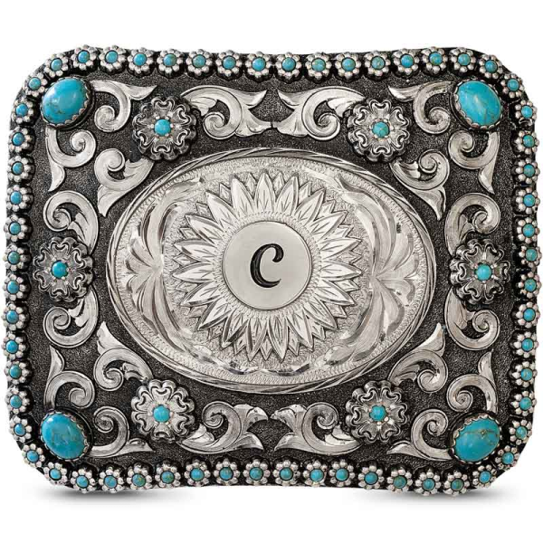 Una hebilla que refleja tu amor por la moda y un estilo atrevido. Esta hebilla  incluye un borde de berrys  (el color de la piedra es personalizable), intrincados rollos de alpaca y un centro ovalado, grabado a mano, un detallado girasol que puede persona